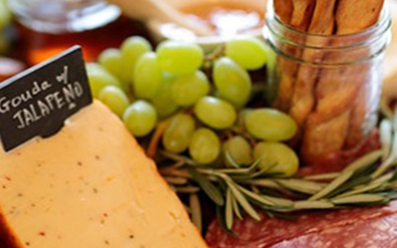 local charcuterie board with cheeses, meats, fruit